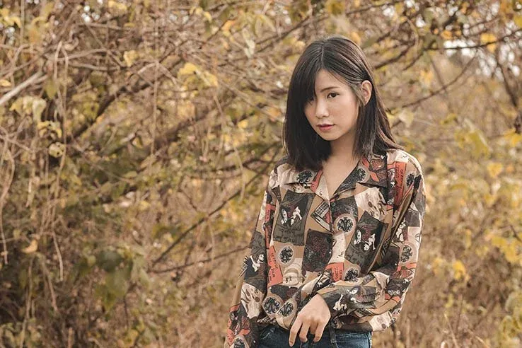 single asian girl in forest